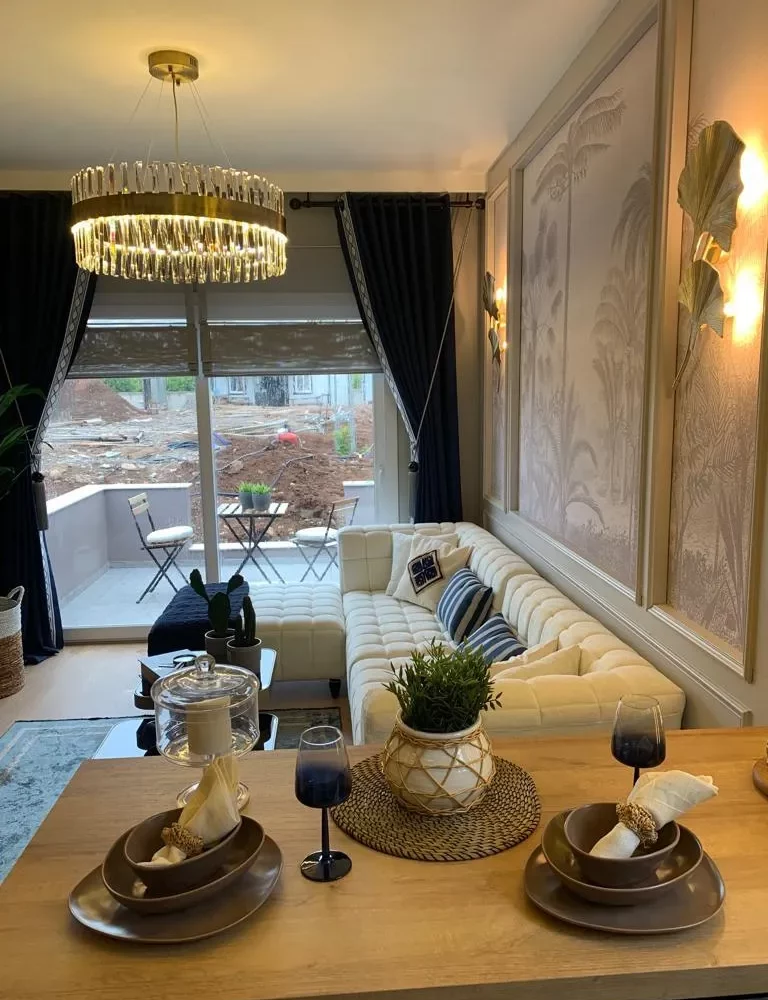 Studio apartment for sale in Mersin Kargipinari – exterior view of the residential complex with pool