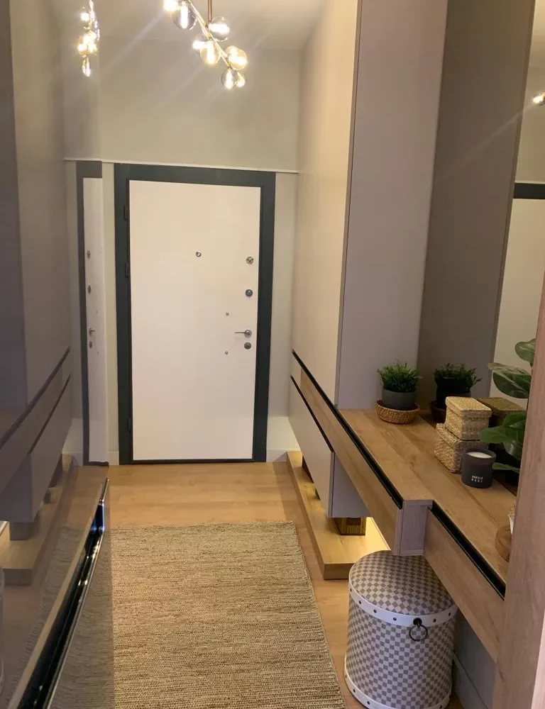 Studio apartment for sale in Mersin Kargipinari – exterior view of the residential complex with pool