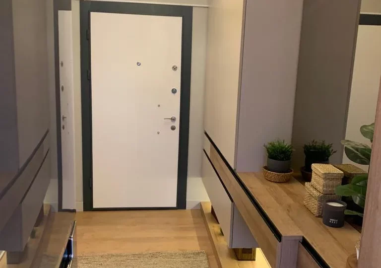 Studio apartment for sale in Mersin Kargipinari – exterior view of the residential complex with pool