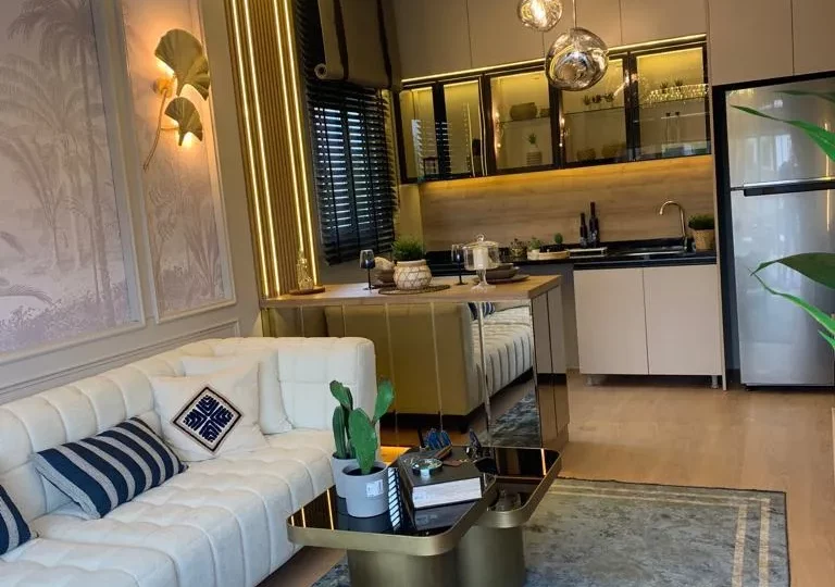 Studio apartment for sale in Mersin Kargipinari – exterior view of the residential complex with pool