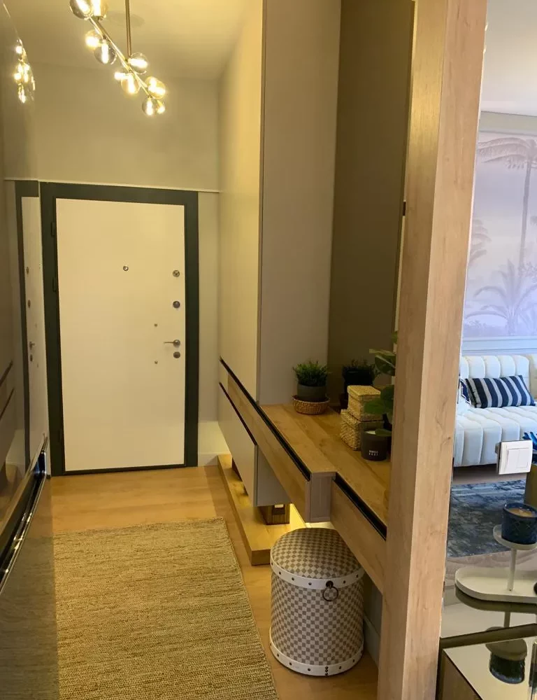 Studio apartment for sale in Mersin Kargipinari – exterior view of the residential complex with pool