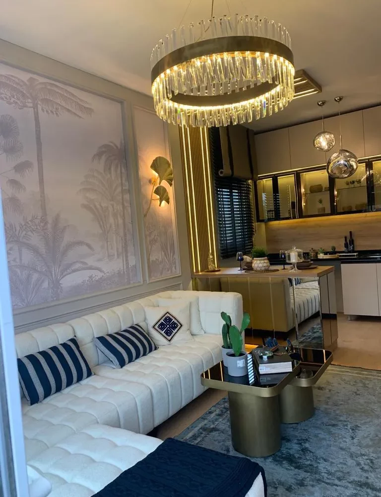 Studio apartment for sale in Mersin Kargipinari – exterior view of the residential complex with pool