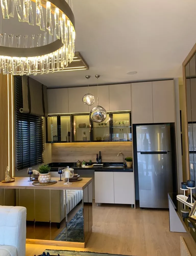 Studio apartment for sale in Mersin Kargipinari – exterior view of the residential complex with pool