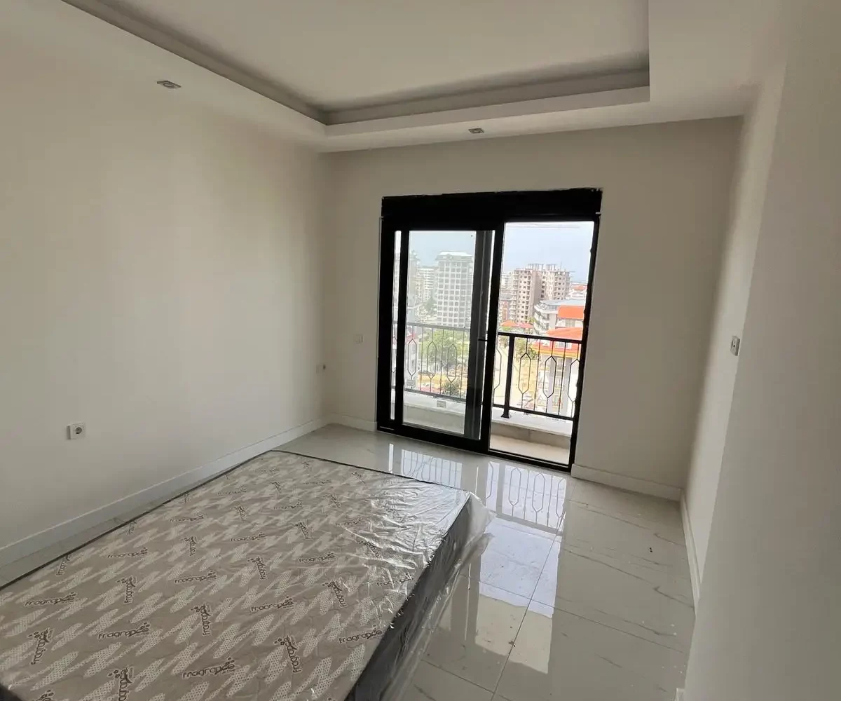 Two-bedroom apartment for sale in Mahmutlar Alanya – exterior view of the residential building in Mahmutlar