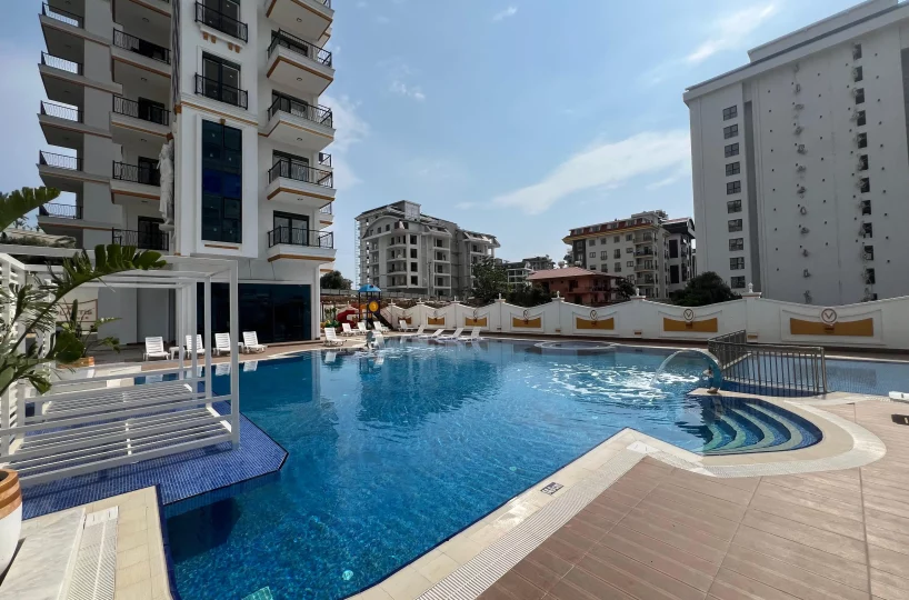 Two-bedroom apartment for sale in Mahmutlar Alanya – exterior view of the residential building in Mahmutlar