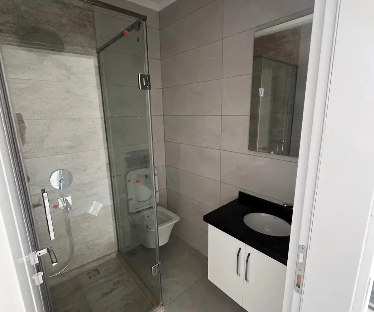 Two-bedroom apartment for sale in Mahmutlar Alanya – exterior view of the residential building in Mahmutlar