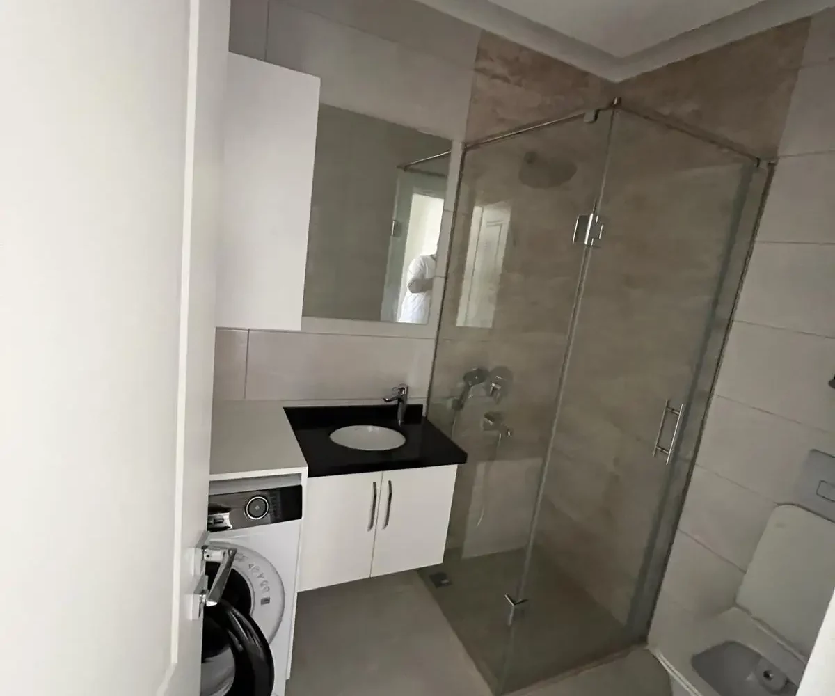 Two-bedroom apartment for sale in Mahmutlar Alanya – exterior view of the residential building in Mahmutlar