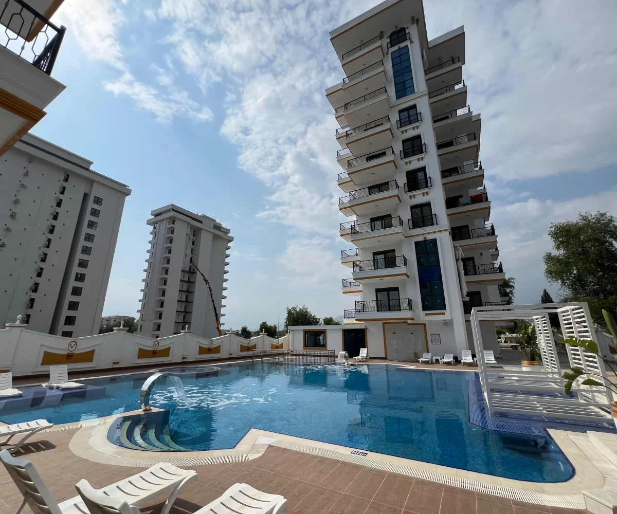 Two-bedroom apartment for sale in Mahmutlar Alanya – exterior view of the residential building in Mahmutlar